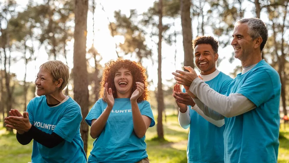 A group of people clapping